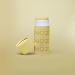 Load image into Gallery viewer, front view of Nöz sunscreen in yellow uncapped
